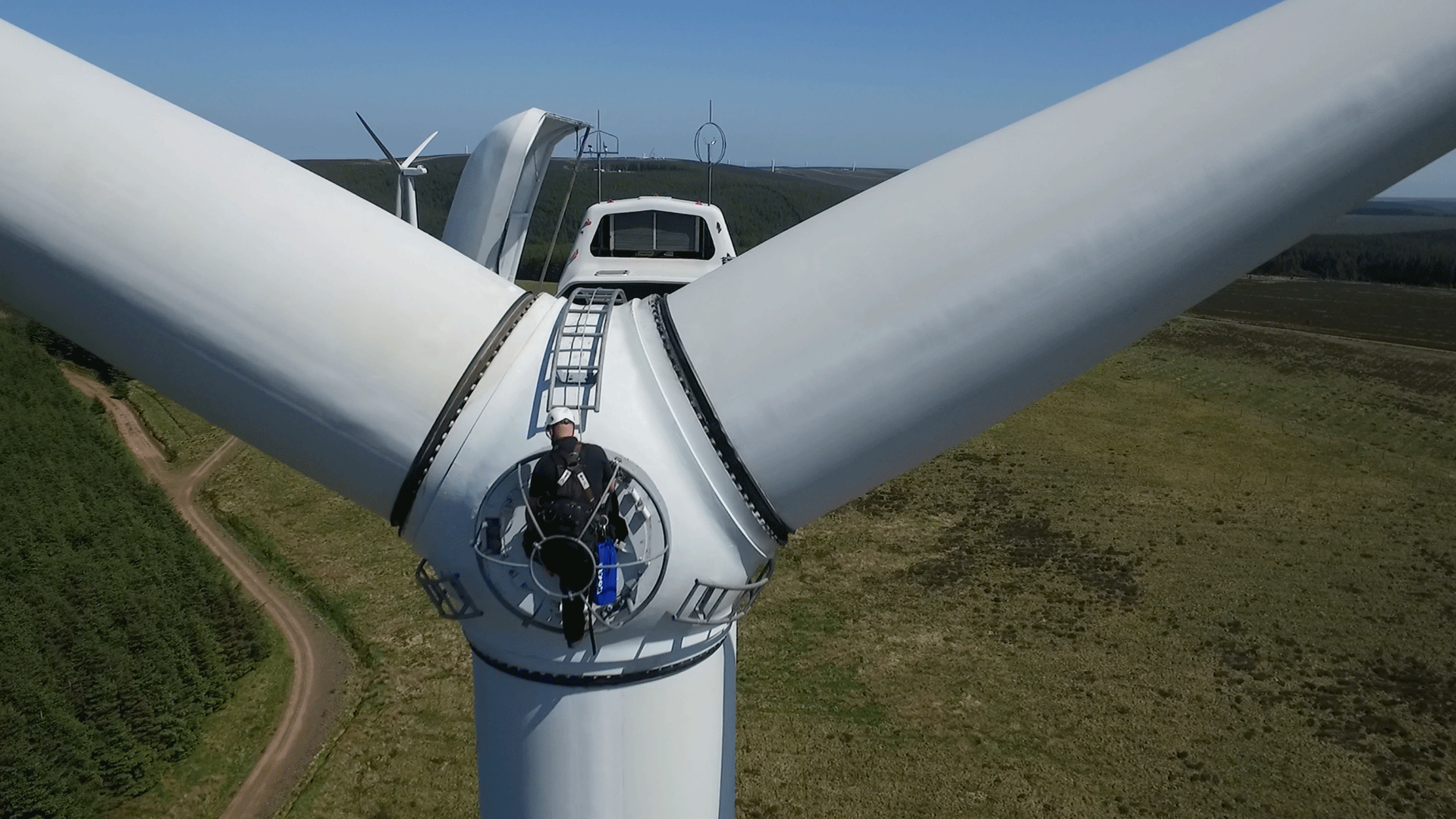 Technician servicing a wind turbine